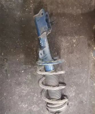 Nissan X-Trail T31 Front shock absorber with coil spring