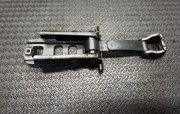 Front door check strap stopper