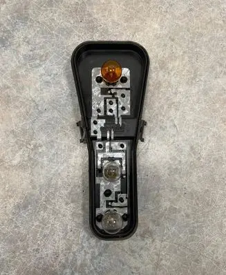 Tail light bulb cover holder