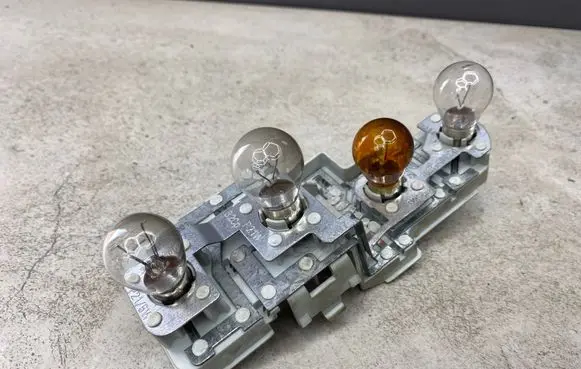 Tail light bulb cover holder