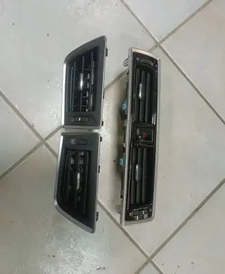 Subaru Legacy Dash center air vent grill 66110AL20A