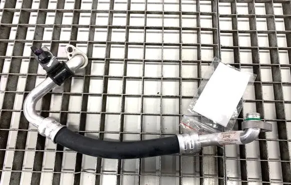 Hyundai Kona II Air conditioning (A/C) pipe/hose 97763HF110