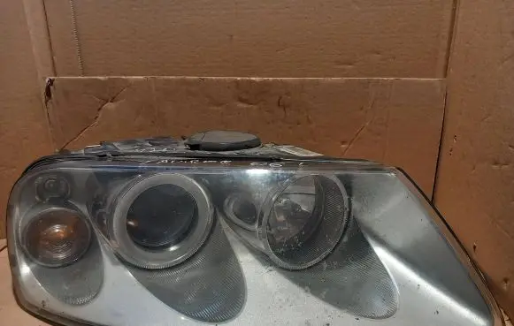 Volkswagen Touareg I Headlight/headlamp 89308481