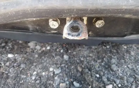 Front door check strap stopper