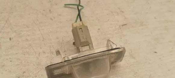Mazda Premacy Number plate light E110384 SAEL96DOT