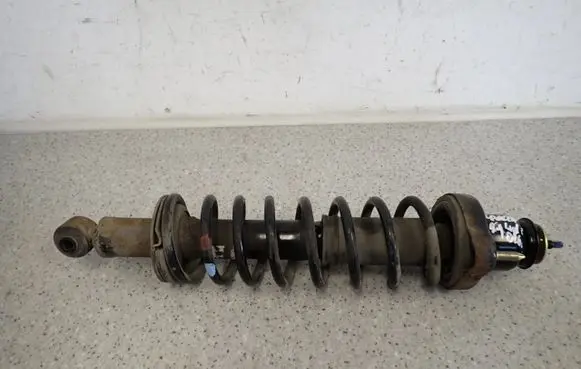 Mitsubishi Lancer Front shock absorber with coil spring