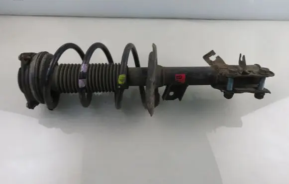 Front shock absorber with coil spring