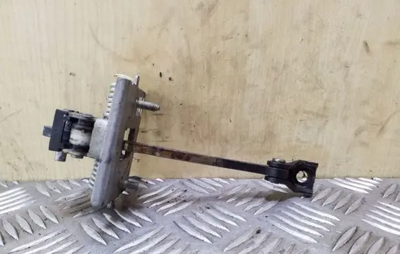 Front door check strap stopper
