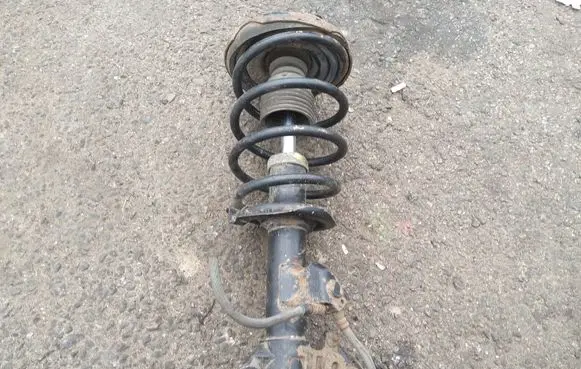 Nissan Primera Front shock absorber with coil spring