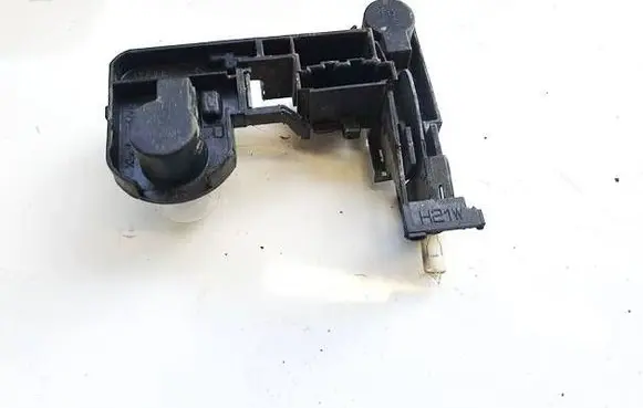Tail light bulb cover holder