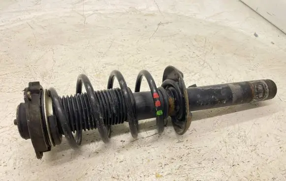 Volkswagen Tiguan Front shock absorber with coil spring 1K0412331C