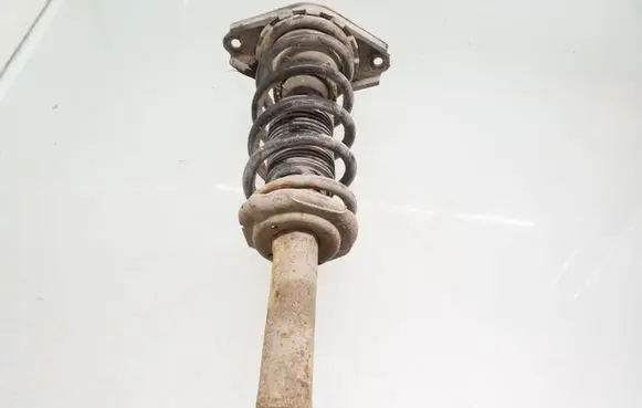 Nissan Almera N16 Rear shock absorber with coil spring