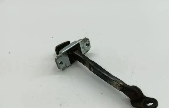 Front door check strap stopper