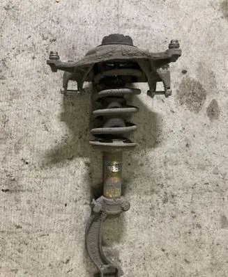Front shock absorber with coil spring