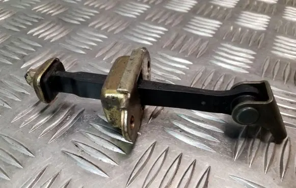 Nissan Primera Front door check strap stopper