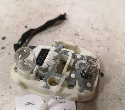 Tail light bulb cover holder