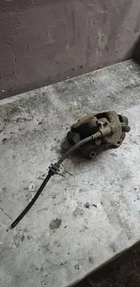 Opel Corsa E Front brake caliper 