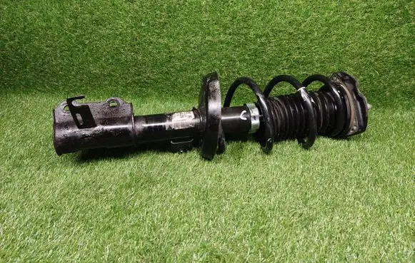 Opel Astra J Front shock absorber with coil spring 13354026