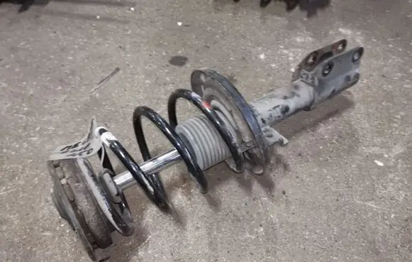 Renault Megane III Front shock absorber with coil spring
