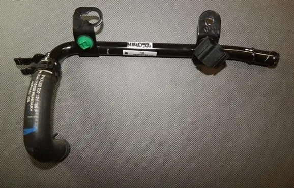 Volkswagen Touareg II Engine coolant pipe/hose 03H121065D
