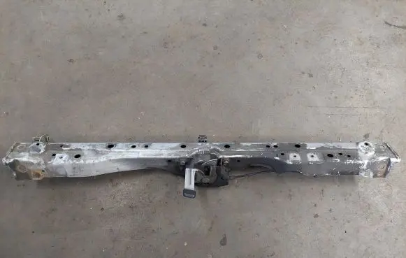 Top upper radiator support slam panel