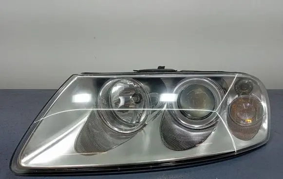 Volkswagen Touareg I Headlight/headlamp 083411119L
