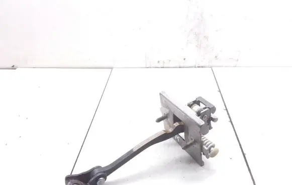 Front door check strap stopper