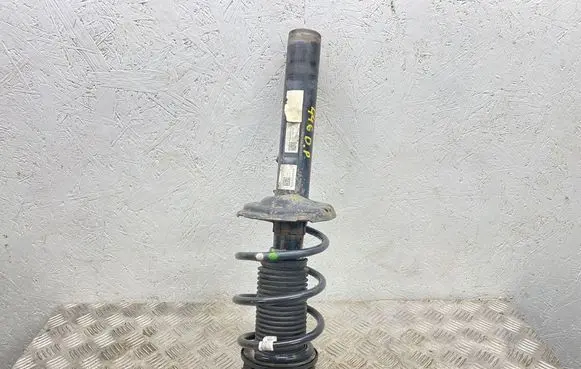 Volkswagen Golf VII Front shock absorber with coil spring 5Q0412037QH 5Q0413031GG