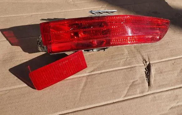 Volkswagen Touareg II Rear bumper light 7P6945702F 7P6945106