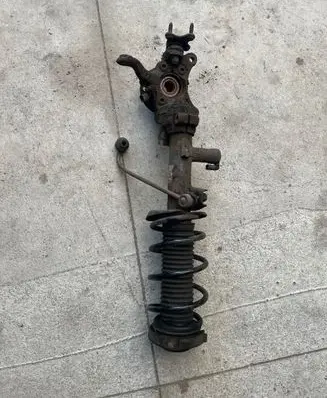 Front shock absorber with coil spring