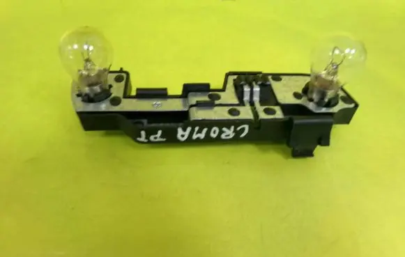 Tail light bulb cover holder