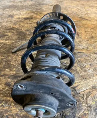 Front shock absorber with coil spring