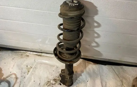 Opel Corsa D Front shock absorber/damper 13214358 27385
