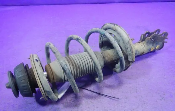 Front shock absorber with coil spring