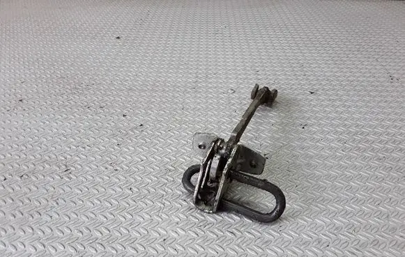 Front door check strap stopper