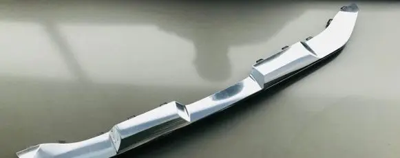 Rear bumper trim bar molding