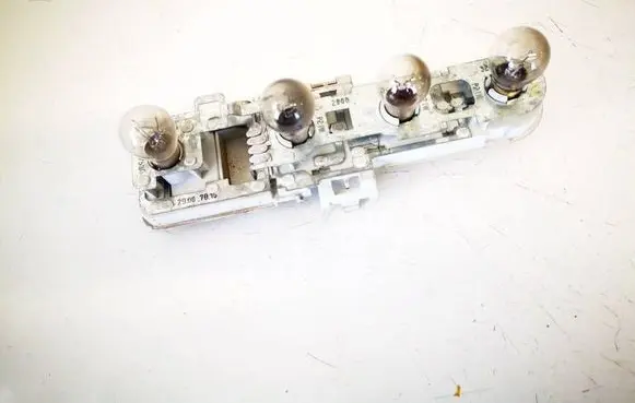 Tail light bulb cover holder