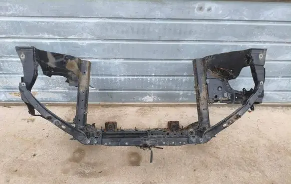 Radiator support slam panel