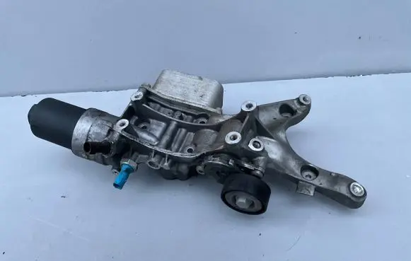 Volkswagen Jetta VI Oil filter mounting bracket 06K903143 06K117021G