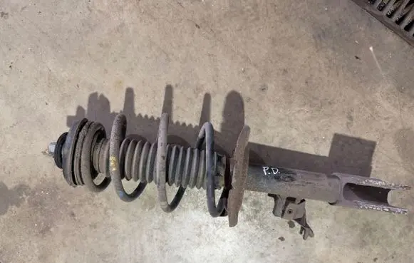 Citroen Berlingo Front shock absorber with coil spring