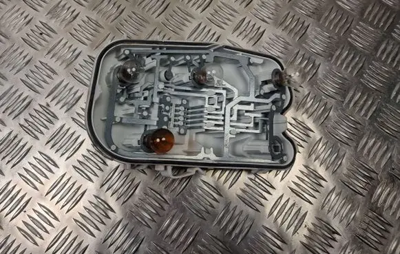 Tail light bulb cover holder