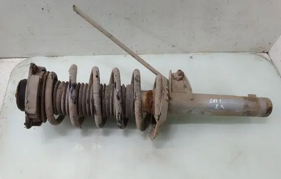 Volkswagen Caddy Front shock absorber with coil spring