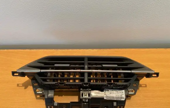 Dash center air vent grill