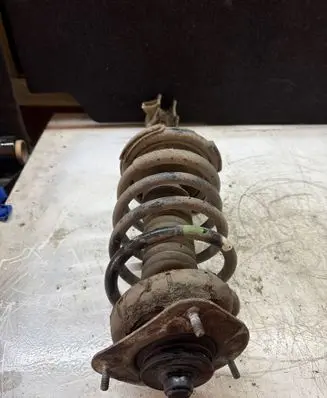 Front shock absorber with coil spring