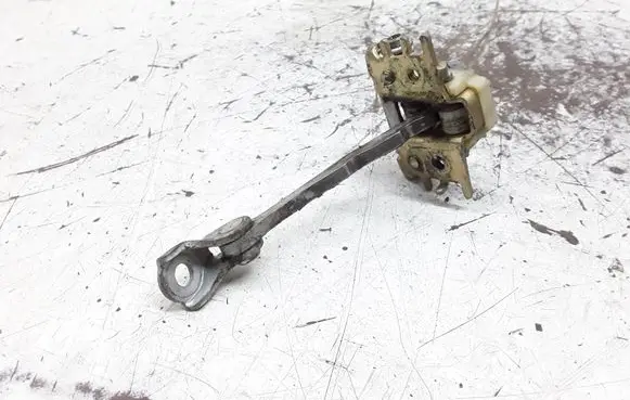 Front door check strap stopper