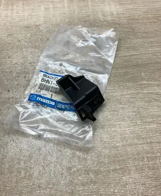 Mazda 3 II Headlight/headlamp mounting bracket BHM150162