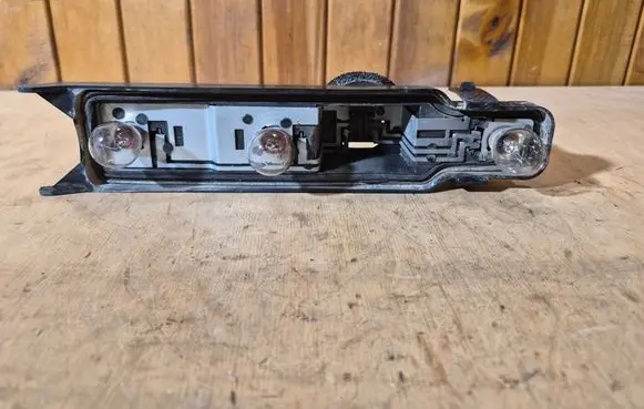 Ford Focus Tail light bulb cover holder XS4X13N004