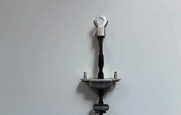 Front door check strap stopper