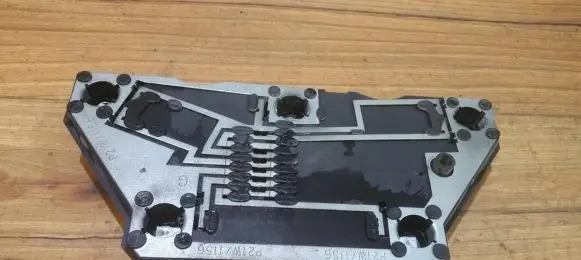 Tail light bulb cover holder