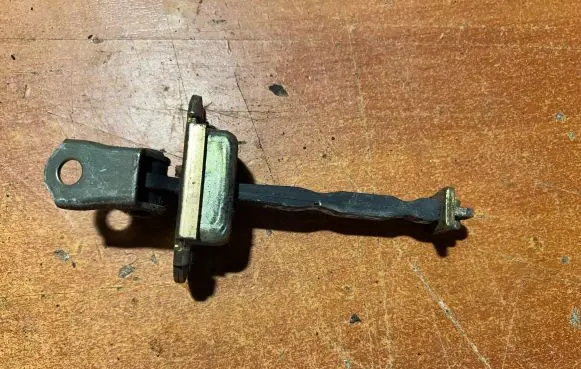 Nissan Micra Rear door check strap stopper